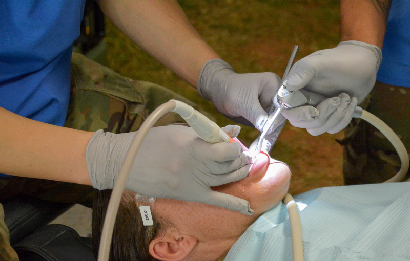 Soldiers from Dental Health Command-Europe conduct a dental exam, Sept. 4, on a Soldier. (U.S. Army photo by Russell Toof)
