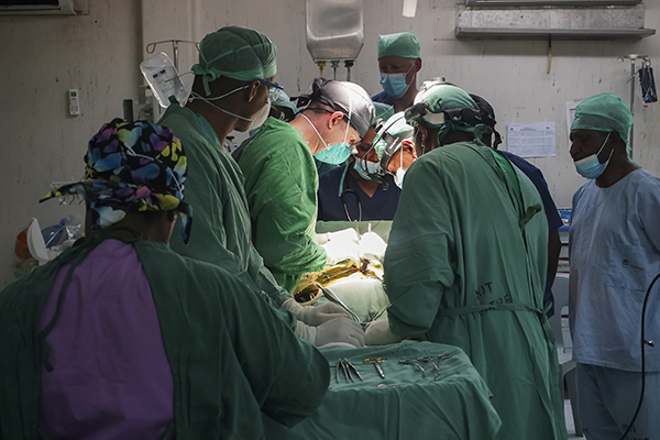 A U.S. Army medical team assigned to 8th Forward Resuscitative and Surgical Detachment, 18th Medical Command, and a Port Moresby General Hospital surgical team conduct a surgical ligation of patent ductus to correct a breathing abnormality due to a birth defect on a 2-year-old girl during the inaugural Papua New Guinea Trauma Rotation in Port Moresby General Hospital at Port Moresby, Papua New Guinea, Dec. 10, 2023. 